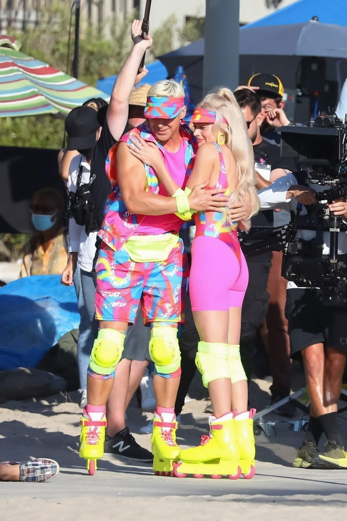 Margot Robbie And Ryan Gosling Put On A Colorful Display While Filming A Roller Skating Scene