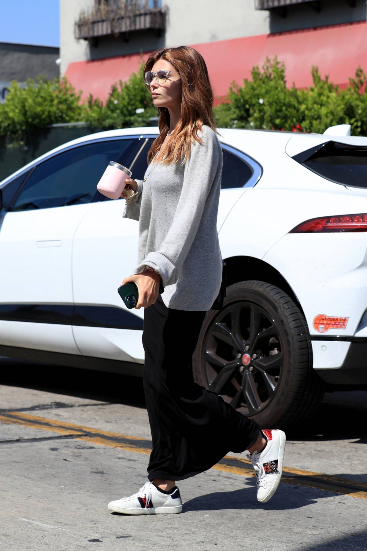 Sydney Sweeney shows off her fab physique in a grey sports bra and leggings  while heading
