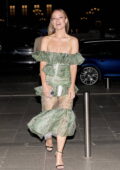 Olivia Wilde looks gorgeous in a green off-shoulder dress as she arrives at her hotel in Paris, France