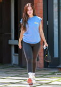 Addison Rae sports a blue top and black leggings white attending her Pilates class in West Hollywood, California