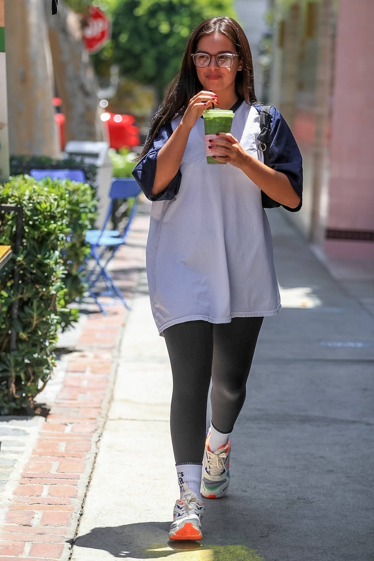 addison rae wears an oversized t-shirt and leggings while grabbing a green  smoothie at alfred tea room in west hollywood, california-250722_11
