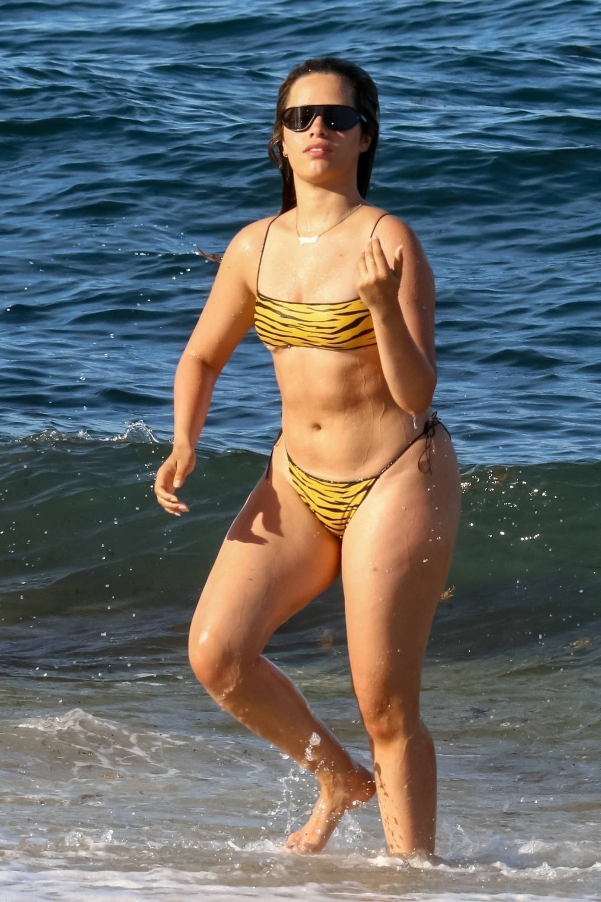 camila cabello shows off her curvy figure in an animal print bikini as she  hits the beach in coral gables, florida-080722_24