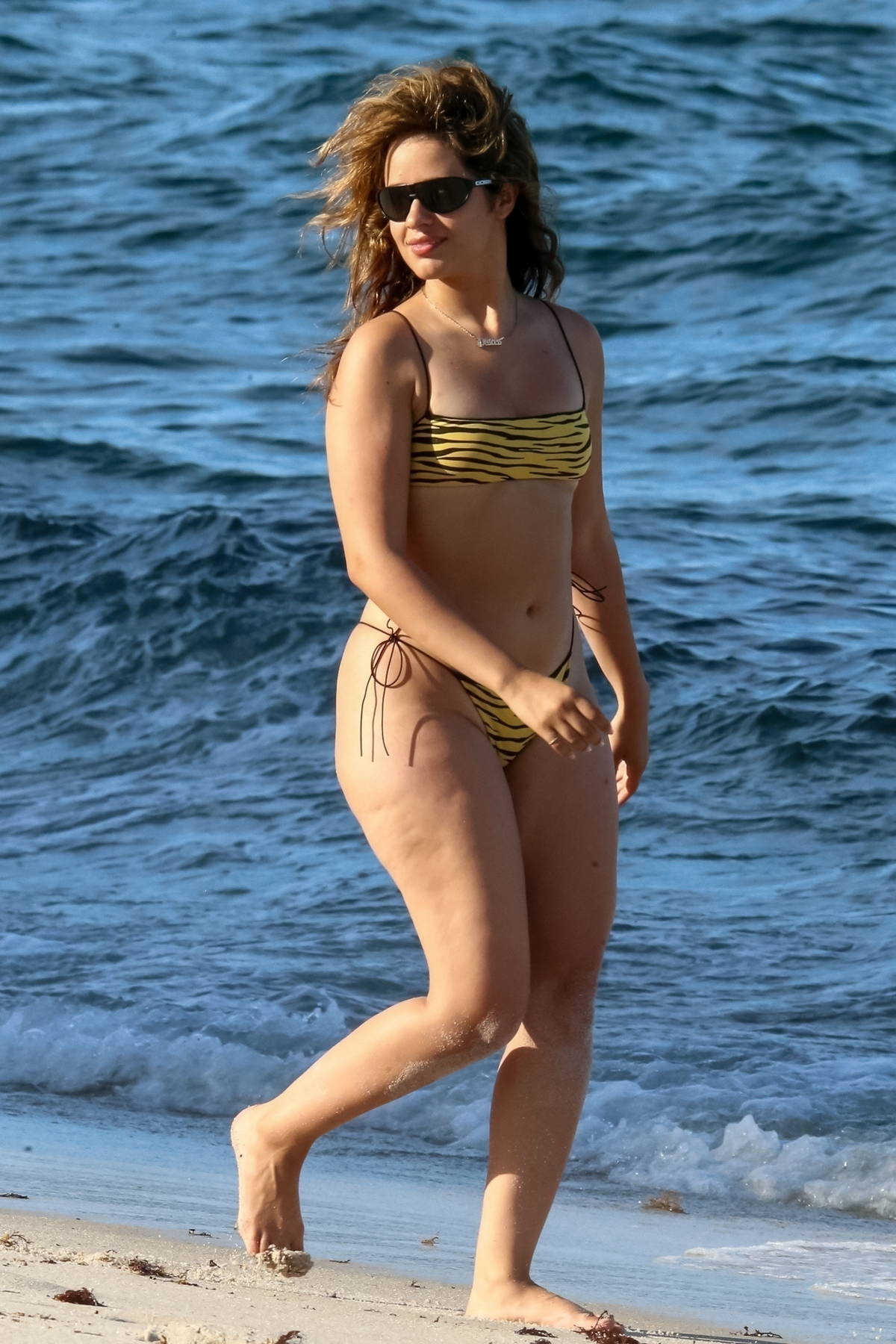 camila cabello shows off her curvy figure in an animal print bikini as she  hits the beach in coral gables, florida-080722_3