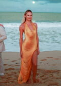 Candice Swanepoel looks gorgeous in a yellow fringe dress while attending Lais Ribeiro's beach wedding in Brazil