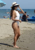 Eva Longoria shows off her beach body in a white swimsuit while enjoying her vacation in Marbella, Spain