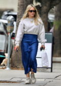 Hilary Duff looks great in a cropped sweater and satin blue skirt while picking up breakfast from Joan's On Third in Studio City, California