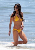 Jordana Brewster slips into an orange bikini during a beach day in Santa Monica, California