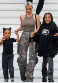 Kim Kardashian rocks a skin-tight tank top and stone-washed cargo pants  while out with