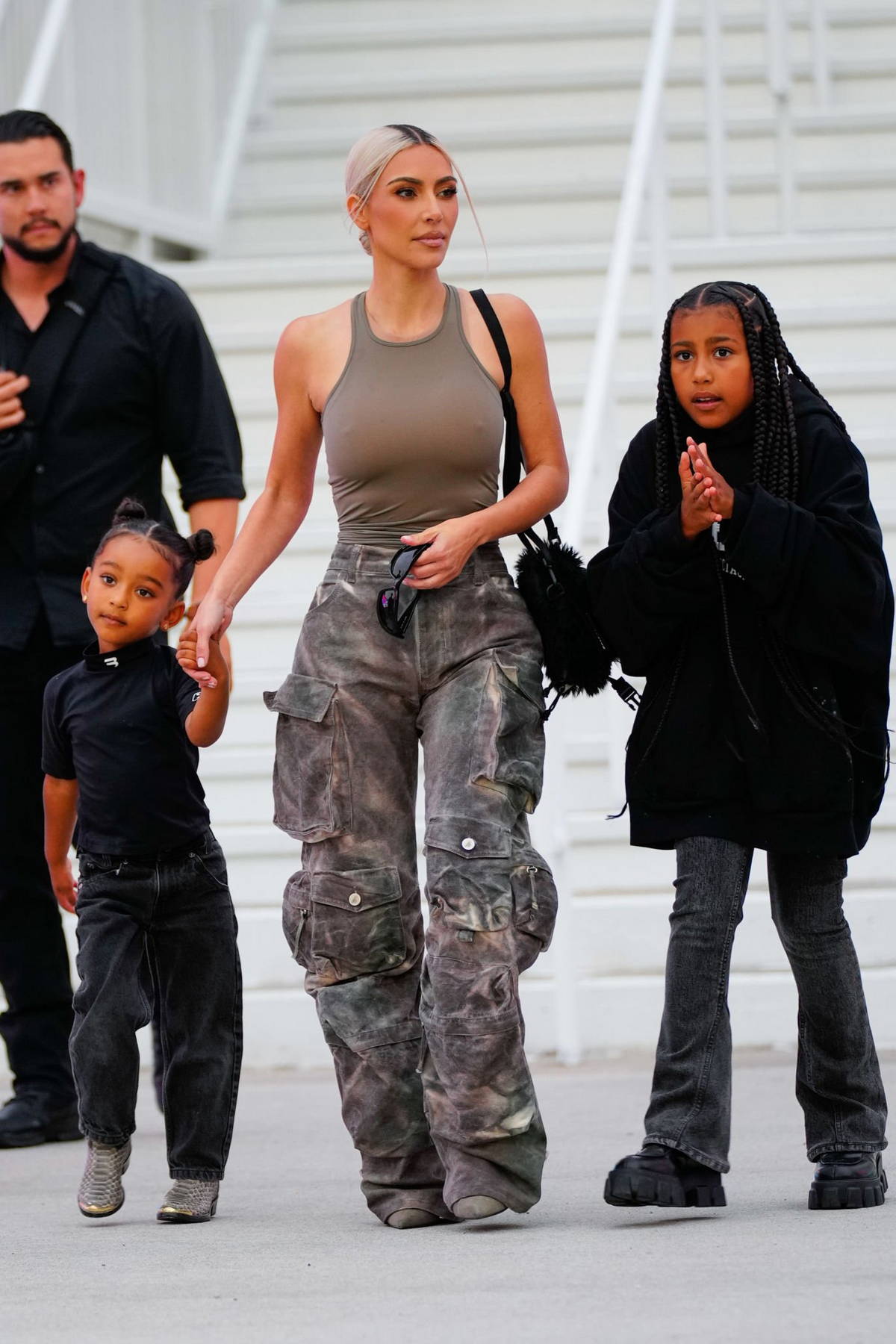 Kim Kardashian rocks a skin-tight tank top and stone-washed cargo