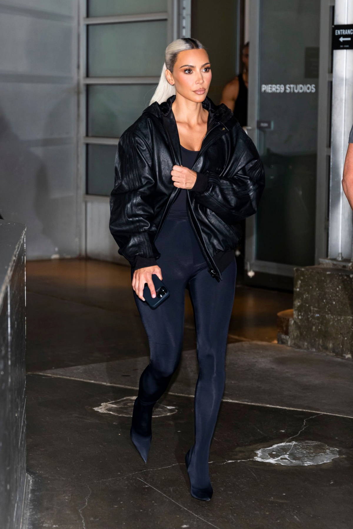 kim kardashian rocks an all-black look while arriving at the polo bar ...