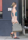 Kristen Bell shows off her athletic physique in tank top and