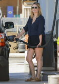 Mischa Barton cuts a casual figure in a navy shirt and black shorts as she stops for gas while running errands in Los Angeles
