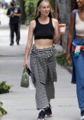 Scout Willis wears striped pants and a black crop top tank top while grabbing a coffee in West Hollywood, California