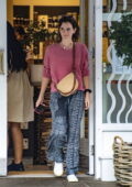 Emma Watson wears a pink sweater with boho pants while out shopping with a friend in London, UK