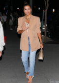 Eva Longoria wears a light peach blazer and blue jeans while out to dinner at BOA Steakhouse in West Hollywood, California