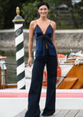 Grace Elizabeth looks stylish in a blue silk camisole and flared jeans during the 79th Venice Film Festival in Venice, Italy