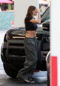 Hailey Bieber shows off her toned midriff in a black crop top while  visiting an office building in Beverly Hills, California
