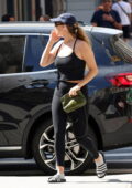 Jennifer Lawrence looks fit in a black tank top and leggings while