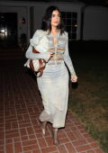 Kylie Jenner looks stylish in a denim dress and snakeskin boot while leaving the 818 Tequila investor's event in Beverly Hills, California