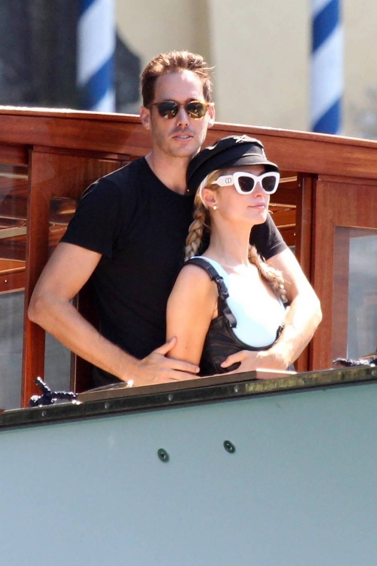 Paris Hilton looks stylish in a blue Louis Vuitton sarong while enjoying  her summer holiday with