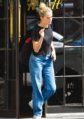 Zoey Deutch wears a black tee and blue jeans as she leaves The Bowery Hotel in New York City