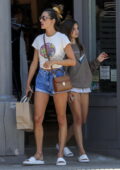 Alessandra Ambrosio changes into denim shorts from her orange sweatpants during a shopping trip before lunch at Gjelina in Venice Beach, California