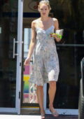 Candice Swanepoel looks great in a floral print sundress while stopping by a gas station in Miami Beach, Florida