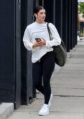 Charli D'Amelio sports a white sweatshirt and black leggings while seen  outside the DWTS rehearsal Studio in Los Angeles