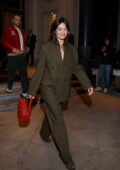 Emma Mackey looks great in an olive green suit while leaving her hotel during Milan Fashion Week in Milan, Italy