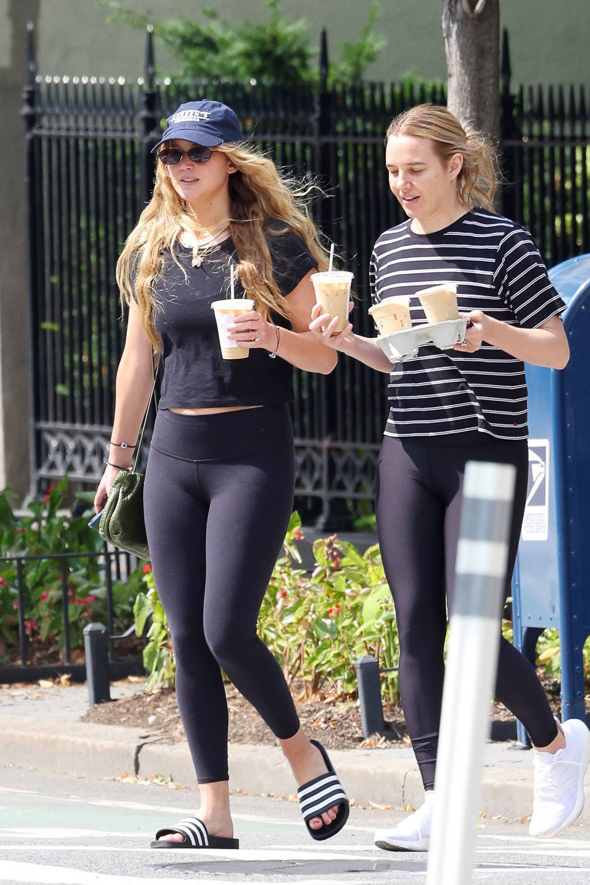 Jennifer Lawrence Wears A Cropped Tee And Leggings While She Grabs A