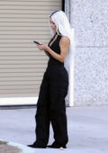 Kim Kardashian spotted in a black bodysuit with matching cargo pants while  taking a phone call