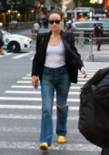 Olivia Wilde looks great in a white top with a black blazer and blue jeans while out in New York City