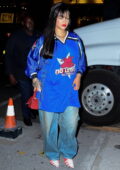 Rihanna dons an oversized blue jersey and baggy jeans while out for dinner with friends at Caviar House restaurant in New York City