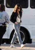Anne Hathaway dons a black jacket, white shirt and jeans while heading to the set of 'The Idea of You' in Atlanta, Georgia