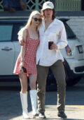 Anya Taylor-Joy looks cute in a red gingham mini dress while out for lunch with beau Malcolm McRae in Studio City, California