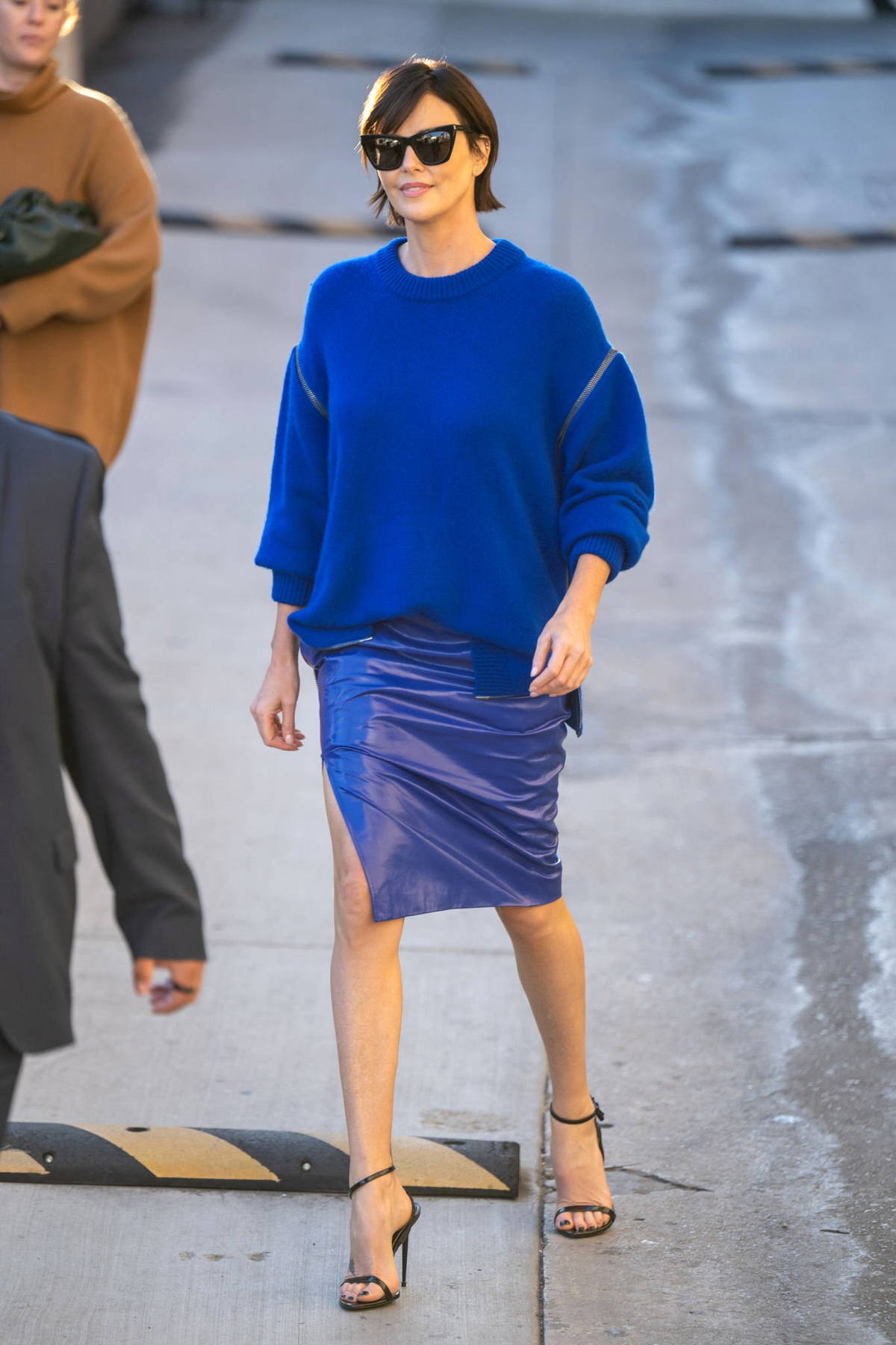 Charlize Theron goes casual chic in navy blue at celebrity hotspot