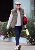 Emma Watson rocks a white sweatshirt and black leggings while stepping out  with friends in Miami