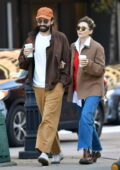 Elizabeth Olsen walks arm in arm with husband Robbie Arnett during a coffee run in New York City