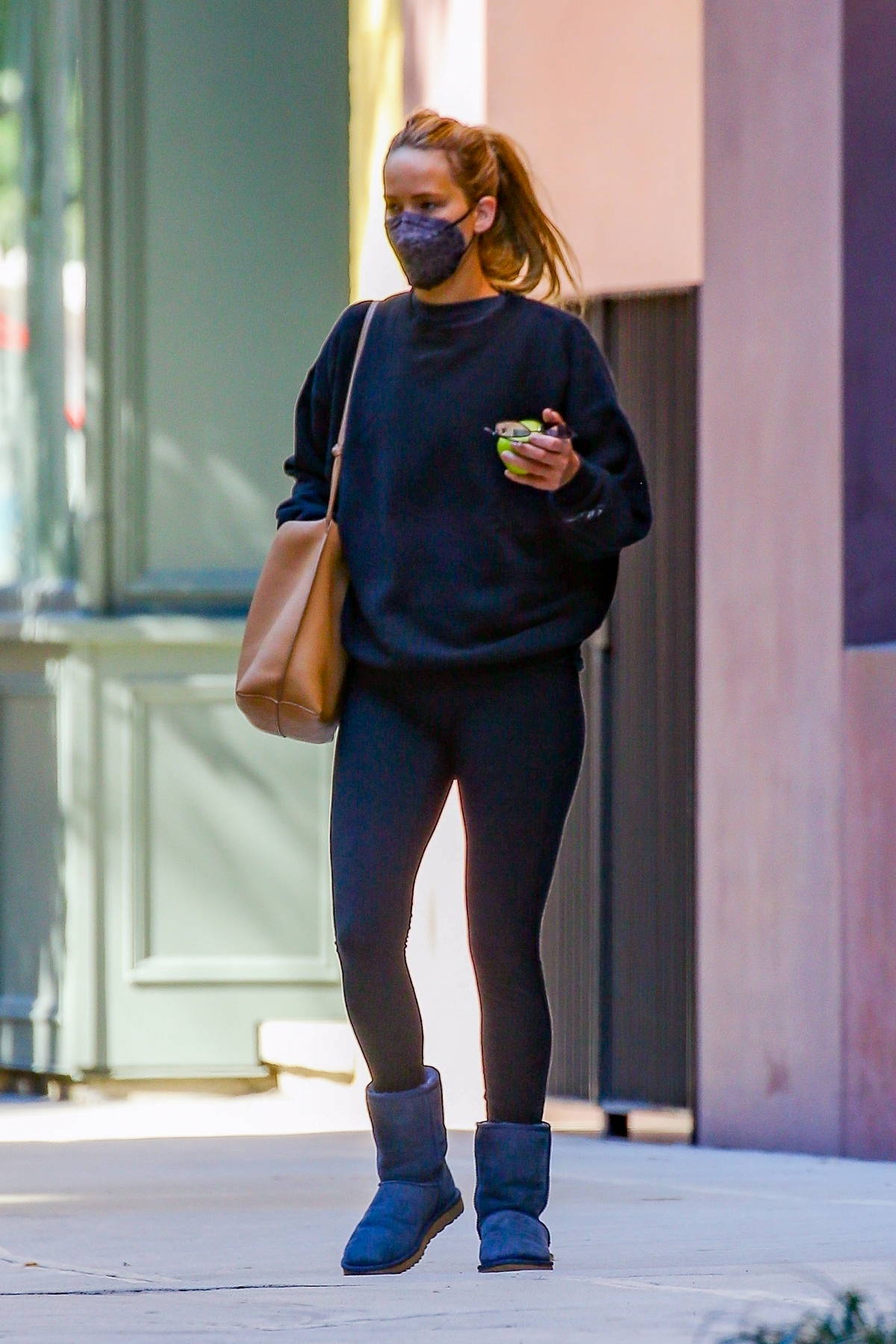 jennifer lawrence keeps it cozy in a black sweater paired with matching  leggings and uggs while heading out in new york city-061022_3