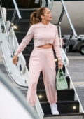 Jennifer Lopez looks casually chic in pink sweats as she touches down on a private jet in Los Angeles