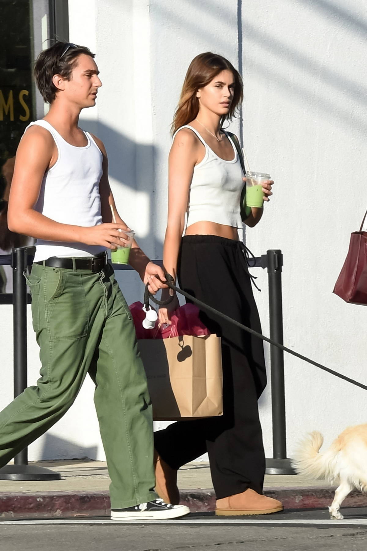 Kaia Gerber opts for a casual look in a tank top and sweatpants while running errands with a friend in Los Feliz, California