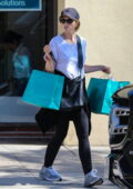 Katherine Schwarzenegger wears a white tee and black leggings while shopping for home décor in Pacific Palisades, California