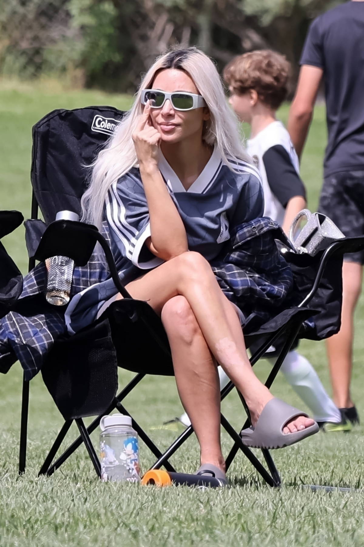 Kim Kardashian seen wearing an oversized Adidas jersey while she takes her  son to a soccer