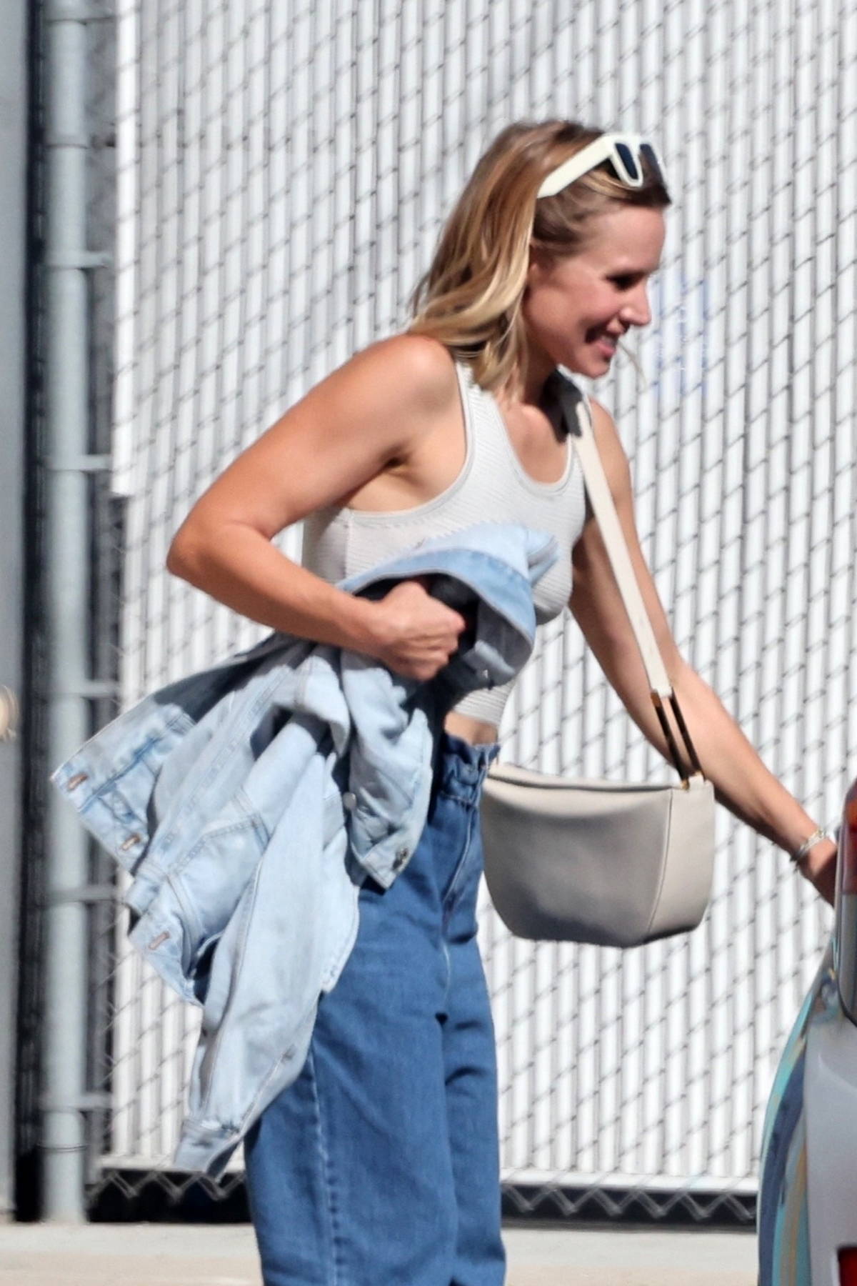 Kristen Bell wears a grey tank top and jeans while out running errands in  Los Angeles