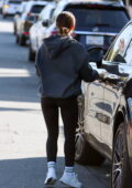 Lucy Hale sports a dark hoodie and leggings while making her morning coffee  run at Blue