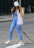 Nina Dobrev rocks patterned blue sports bra and leggings while enjoying a  walk with her dog