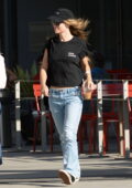 Olivia Wilde keeps it casual in a black tee and jeans while out for coffee with a friend in Los Angeles