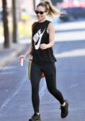 Olivia Wilde shows off her fit physique in a Nike tank top and leggings while leaving the gym in Los Angeles