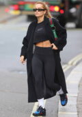Rita Ora looks flashes her toned abs in all-black sports bra and leggings while leaving a gym in London, UK