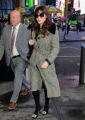 Zooey Deschanel wears a shearling-lined houndstooth trench coat as she arrive at CBS Mornings in New York City